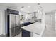 Modern kitchen featuring stainless steel appliances and a breakfast bar at 1204 Dartmouth Dr, Bradenton, FL 34207