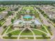Aerial view showing community pool, clubhouse, and homes at 12332 Prairie Valley Ln, Riverview, FL 33579