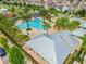 Aerial view of community pool, clubhouse, and surrounding homes at 12332 Prairie Valley Ln, Riverview, FL 33579