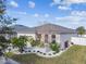 Single-story home with landscaped yard and two-car garage at 12332 Prairie Valley Ln, Riverview, FL 33579