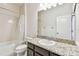 Bathroom with granite countertop, single sink, and shower/tub combo at 12332 Prairie Valley Ln, Riverview, FL 33579