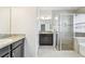 Bathroom with granite countertop and large walk-in shower at 12332 Prairie Valley Ln, Riverview, FL 33579