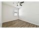 Bedroom with wood-look floors and ceiling fan at 12332 Prairie Valley Ln, Riverview, FL 33579