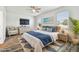 Main bedroom with a large bed, dresser, and armchair at 12332 Prairie Valley Ln, Riverview, FL 33579