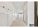 Bright entry hall with tile flooring, leading to living areas and pool view at 12332 Prairie Valley Ln, Riverview, FL 33579