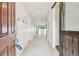 Bright entryway with barn door and view of the pool at 12332 Prairie Valley Ln, Riverview, FL 33579