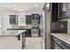 Spacious kitchen with granite countertops, stainless steel appliances, and dark wood cabinets at 12332 Prairie Valley Ln, Riverview, FL 33579