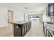 Open concept kitchen overlooking Gathering room and pool at 12332 Prairie Valley Ln, Riverview, FL 33579