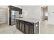 Modern kitchen island with granite countertops and stainless steel appliances at 12332 Prairie Valley Ln, Riverview, FL 33579