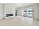 Living room with fireplace and access to backyard pool at 12332 Prairie Valley Ln, Riverview, FL 33579
