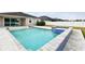 Relaxing pool and spa with tiled accents and spacious patio at 12332 Prairie Valley Ln, Riverview, FL 33579