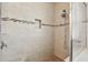 Walk-in shower with tile surround and built-in seat at 12332 Prairie Valley Ln, Riverview, FL 33579