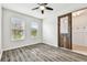 Spacious spare bedroom with wood-look flooring and large windows at 12332 Prairie Valley Ln, Riverview, FL 33579