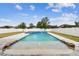 Stunning, pristine pool with a sandy beach entry and spa at 12332 Prairie Valley Ln, Riverview, FL 33579