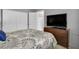 Bedroom with double doors and dresser at 12400 Park Blvd # 206, Seminole, FL 33772