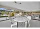 Covered patio area with tables and chairs, overlooking the pool at 12400 Park Blvd # 206, Seminole, FL 33772
