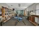 Community room with bookshelves, fitness equipment, and seating at 12400 Park Blvd # 206, Seminole, FL 33772