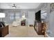 Living room features gray walls, carpeted floors, and a ceiling fan at 12400 Park Blvd # 206, Seminole, FL 33772