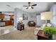 Open living room with a view of the kitchen and gray walls at 12400 Park Blvd # 206, Seminole, FL 33772