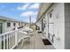 Private patio with white wicker furniture at 12400 Park Blvd # 206, Seminole, FL 33772