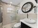 Modern bathroom with a walk-in shower and stylish vanity at 12632 Oak Hollow Ct, Dade City, FL 33525