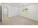 Bright bedroom with wood-look floors and window shutters at 12632 Oak Hollow Ct, Dade City, FL 33525