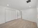 Bright bedroom with double doors and wood-look floors at 12632 Oak Hollow Ct, Dade City, FL 33525