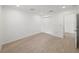 Spacious bedroom featuring wood-look floors and double doors at 12632 Oak Hollow Ct, Dade City, FL 33525