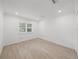 Bright bedroom with wood-look floors and window shutters at 12632 Oak Hollow Ct, Dade City, FL 33525