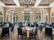 Upscale dining room with elegant decor and large windows at 12632 Oak Hollow Ct, Dade City, FL 33525