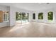 Gathering room with sliding doors to pool area and wood-look floors at 12632 Oak Hollow Ct, Dade City, FL 33525