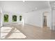 Gathering Room with access to pool and natural light at 12632 Oak Hollow Ct, Dade City, FL 33525