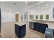 Kitchen features island, stainless steel appliances, and view to backyard pool at 12632 Oak Hollow Ct, Dade City, FL 33525