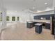 Modern kitchen with dark blue cabinetry and stainless steel appliances at 12632 Oak Hollow Ct, Dade City, FL 33525