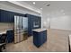 Modern kitchen with stainless steel appliances and dark blue cabinetry at 12632 Oak Hollow Ct, Dade City, FL 33525