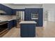 Modern kitchen with stainless steel appliances and island at 12632 Oak Hollow Ct, Dade City, FL 33525