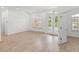 Bright living room with hardwood floors, and large windows at 12632 Oak Hollow Ct, Dade City, FL 33525