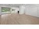 Open living space hardwood floors, pool view at 12632 Oak Hollow Ct, Dade City, FL 33525