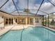 Inviting screened pool with ample patio space at 12632 Oak Hollow Ct, Dade City, FL 33525