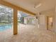 View of the pool and patio from another angle at 12632 Oak Hollow Ct, Dade City, FL 33525