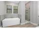 Modern bathroom with soaking tub and glass shower at 13458 Haflinger Way, Hudson, FL 34667