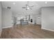 Open concept living area with hardwood floors and kitchen views at 13458 Haflinger Way, Hudson, FL 34667