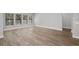 Spacious living area with hardwood floors and large windows at 13458 Haflinger Way, Hudson, FL 34667