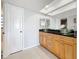 Bathroom with updated vanity and granite countertop at 13600 Egret Blvd # 204K, Clearwater, FL 33762