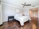 Main bedroom with a queen-size bed, dark hardwood floors, and ceiling fan at 13600 Egret Blvd # 204K, Clearwater, FL 33762