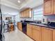 Bright kitchen with wood cabinets, granite counters, and stainless steel appliances at 13600 Egret Blvd # 204K, Clearwater, FL 33762