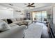 Spacious living room featuring a comfortable sectional sofa and dark hardwood floors at 13600 Egret Blvd # 204K, Clearwater, FL 33762