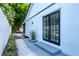 Private back patio with French doors and landscaping at 14040 Cascade Ln, Tampa, FL 33618