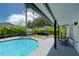 Inviting backyard oasis with a refreshing pool and patio area at 14040 Cascade Ln, Tampa, FL 33618