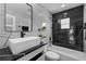 Stylish bathroom with black and white marble tile and floating vanity at 14040 Cascade Ln, Tampa, FL 33618